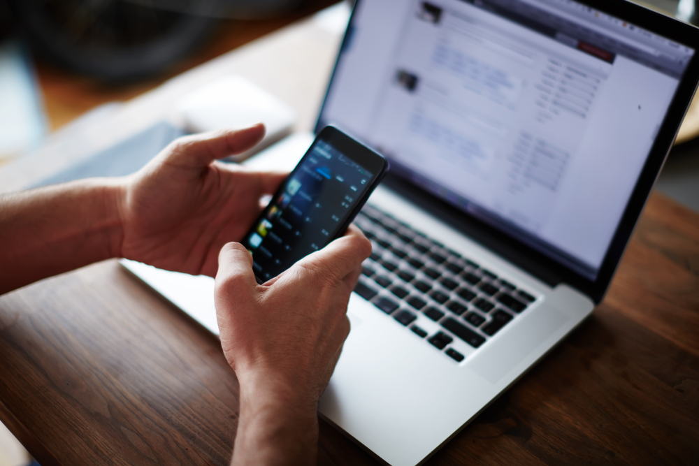 Close,up,male,hands,holding,big,smart,phone,while,connecting